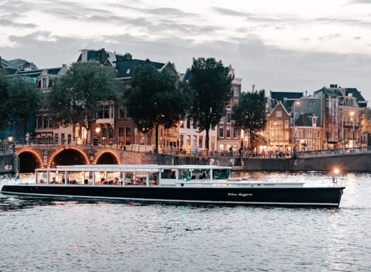 Boat cruising on a city canal.